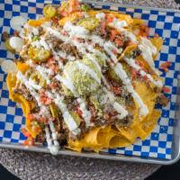 Nachos · Chips, Cheddar Jack Cheese, Black Beans, your choice of Protein, topped with Pico de Gallo, ...