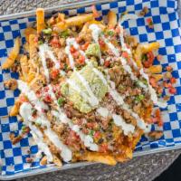 Cali Fries · Fries, Cheddar Jack Cheese, Black Beans and your choice of Protein. topped with Pico de Gall...