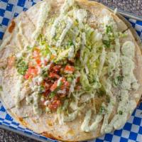 Quesadilla · 12 inch Tortilla, Cheddar Jack Cheese, your choice of Protein , with Guacamole, Sour Cream a...