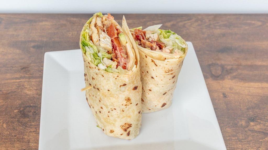 Sally'S Favorite Wrap · Grilled chicken, lettuce, tomato, crisp bacon, American cheese, avocado and chipotle ranch in a warm flour tortilla.