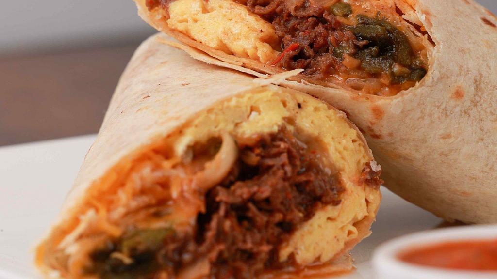 The Ct Crunch · Eggs, ribeye steak, sauteed onions, poblano peppers, mushrooms with a spicy salsa roja and shredded cheddar jack rolled in a flour tortilla wrap. Served with hot sauce.
