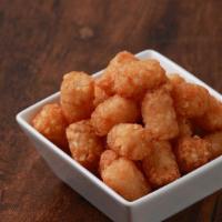 Tater Tots · A fan favorite, these classic tater tots are served gold-brown and crispy.