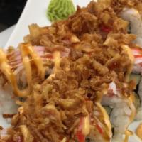 Wasatch Roll · Tempura shrimp, cucumber, and crab salad, topped with crabmeat, spicy mayo, sushi sauce, tem...