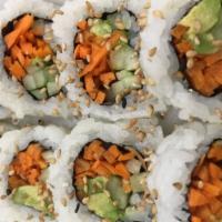 Veggie Roll · Avocado, cucumber, carrot, and red cabbage, topped with sesame seeds.
