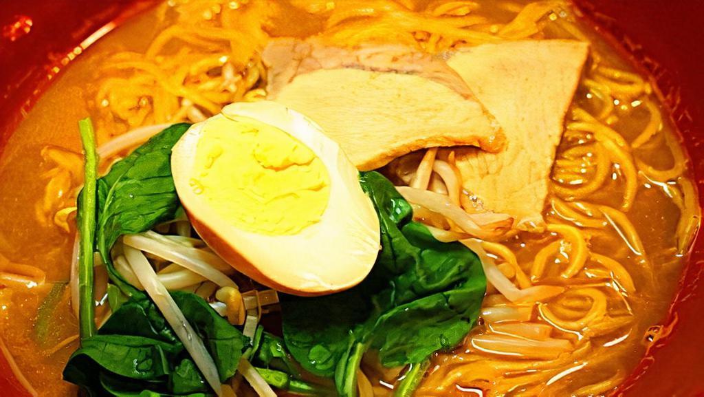 Miso Ramen · Miso broth, slow-simmered pork, boiled egg, bean sprouts, and spinach.