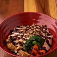 Teriyaki Chicken Bowl · Slow-oven-cooked ginger and garlic marinated chicken over rice, two pieces pot stickers, car...