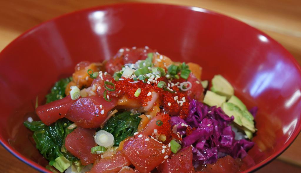 House Spicy Poke Bowl · Spicy. Chopped spicy tuna over sushi rice, seaweed salad, red cabbage, avocado, cucumber, onion, tobiko, spicy mayo, soy sauce, sriracha, Sesame seeds, sesame oil, black pepper.