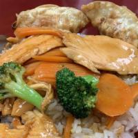 Teriyaki Salmon Bowl · Grilled salmon over rice, two pieces pot stickers, teriyaki sauce, carrots and broccoli. Ses...