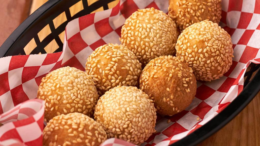 Sesame  Ball · Eight pieces, sweet red bean paste, rice flower, and sesame seeds. Deep fried.