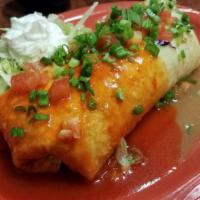 Burrito Enchilado · Filled with cheddar cheese covered in green and red sauce, tomatoes, green onions, and sour ...
