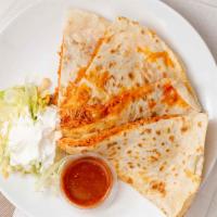 Large Quesadilla · Flour tortilla filled with meat, cheese, lettuce and sour cream.