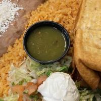 Chimichanga Online · Filled with your choice of meat, cheddar and cotija cheese, pico de gallo, lettuce and sour ...
