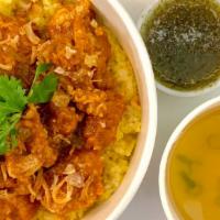 Khao Mhok Gai · Thai sytle biriyani. Turmeric rice top with crispy fried chicken serve with tangy cilantro d...