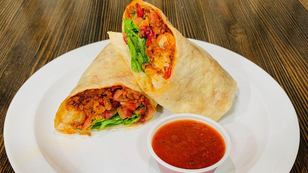 The Morrissey (Vegan) · Our delicious Vegan burrito is back! Loaded with tots, roasted red pepper & red onion mix, soyrizo, house vin and spinach. Served with a side of salsa morita.