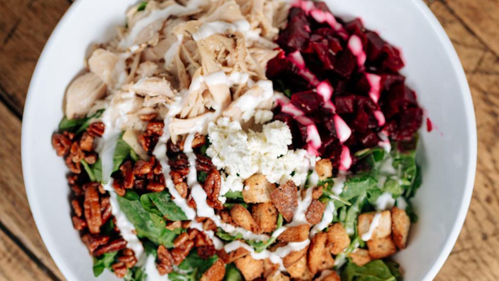 Chicken & Beets · Roasted chicken, diced beets, spinach, arugula, pecans, goat cheese vin, croutons.