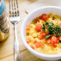 Loaded Mac · Creamy mac and cheese with a kick of poppin' cream cheese, bacon, chopped tomatoes and parsl...