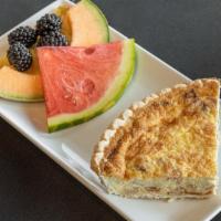 Quiche Lorraine · Bacon, swiss and onion, served with a side of fruit.