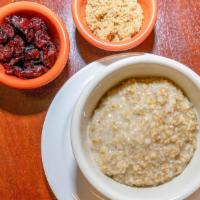 Steel Cut Organic Oats · Served with brown sugar and dried fruit.