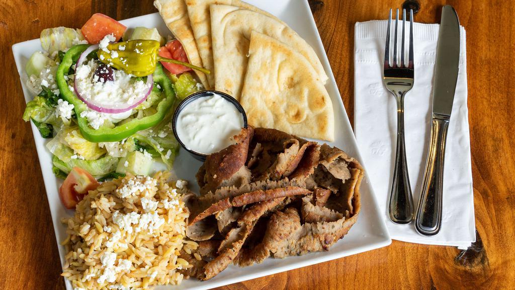 Gyro Meat Plate · Traditional flamed broiled lamb & beef mix. Served w/tzatziki & pita