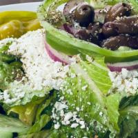 Small Greek Salad · Lettuce, tomato, onion, cucumber, green pepper, feta, Greek olives** & pepperoncini topped w...