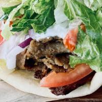 Classic Gyro · Flame broiled seasoned gyro meat, tomato, onion, lettuce & tzatziki