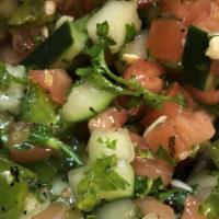 Shirazi Salad · Cucumber, tomato, onion, parsley, lemon juice, olive oil.