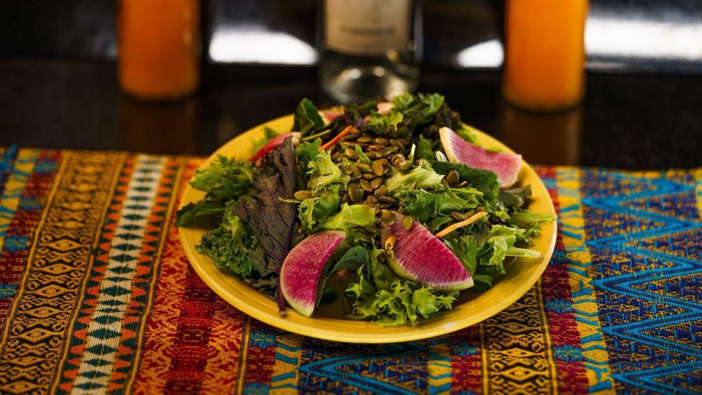 Teote Salad · Mixed greens, carrots and radishes tossed in a citrus dressing with roasted pumpkin seeds. Add a side of meat for an additional charge.