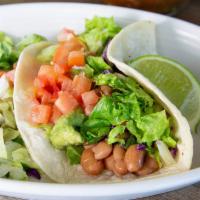 Cody'S Vegan Taco · Corn tortilla, whole beans, guacamole, lettuce, tomato