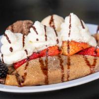 Nutella Crepe · A crepe with seasonal fruit, whipped cream, nutella and two scoops of ice cream