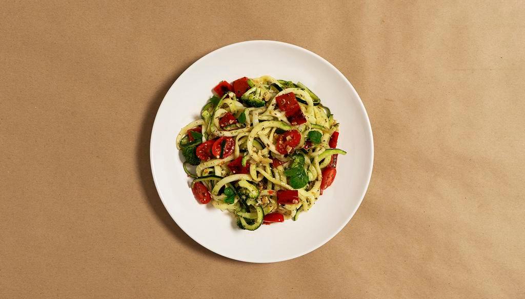 Vegetable Primavera Zoodles · Zucchini noodles in a bright lemon garlic sauce with broccoli, tomatoes, bell peppers, and fresh Parmesan cheese.