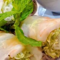 Gỏi Cuốn / Spring Rolls · Two rolls. Steamed pork, shrimp and vegetables wrapped with rice paper and peanut sauce.