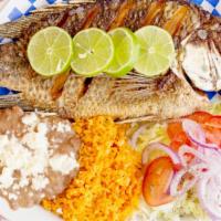 Fried Tilapia (Mojarra) · Fried whole tilapia, served with rice, beans and tortillas.