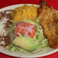 Chile Relleno · Cheese Stuffed Poblano Pepper, With a side of rice, bean, and a salad. Tortillas also includ...