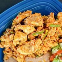 Arroz Con Pollo · Chicken breast chunks cooked with green bell pepper, onions and rice, finished with a touch ...