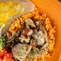 Carnitas Plate · It is a Mexican tradition! Slow roasted pork chunks. Served with rice, beans, lettuce, guaca...