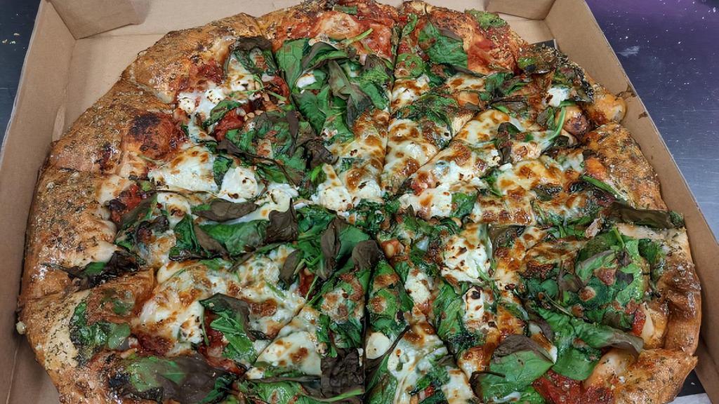 The Greek · Marinara Sauce, Mozzarella Cheese, Minced Garlic, Pine Nuts, Sun-dried Tomatoes, Spinach, & Feta Cheese.. Our Most Popular Vegetarian Option! . Try it with Daiya Cheese for a Delicious Vegan Option!