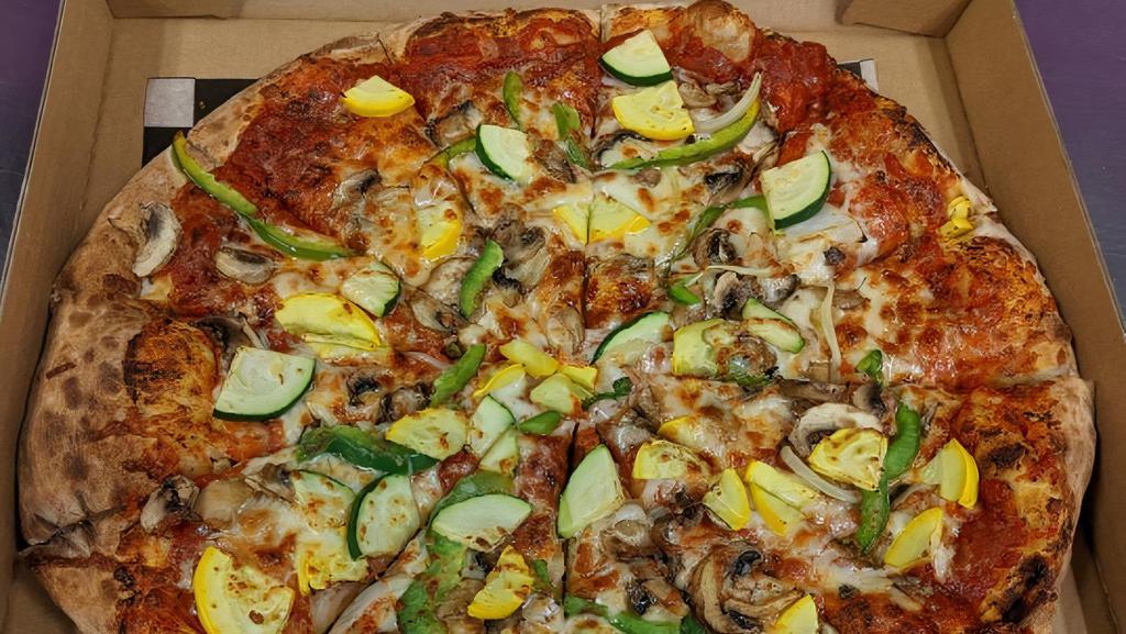 Veggie · Marinara Sauce, Mozzarella Cheese, Zucchini, Yellow Squash, Yellow Onion, Green Pepper, Black Olives, . & Mushrooms.  . A Perfect Specialty Pizza for Vegans, Vegetarians, or Anyone who Loves Veggies!  Try it . with Daiya Cheese for Our Most Popular Vegan Option!