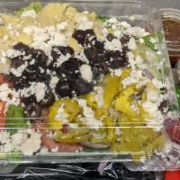 Greek Salad · Romaine Lettuce, Tomatoes, Cucumbers, Red Onions, Artichoke Hearts, Black Olives, Whole Pepp...