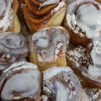 Cinnamon Swirls · Mini House-Made Cinnamon Rolls.  Topped With Powdered Sugar & Covered in Breakfast Icing!