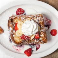 Stuffed French Toast · Stuffed with low fat vanilla yogurt and blackberry jam and topped with fresh strawberries, b...