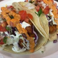 Baja Fish Tacos · Tempura fried tilapia fish, cabbage, pico de gallo, mex cream, chipotle salsa