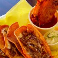 3 Queso-Birria Tacos W/Rice And Beans  · Marinated beef and cheese grilled tacos. Served with birria broth, onions and cilantro on th...