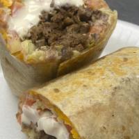 Supremo Burrito · Includes beef, beans, cheese, lettuce, tomatoes and sour cream.