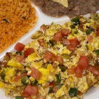 Huevos A La Mexicana · 2 scrambled eggs, jalapeños, onions, tomato. Served with rice, beans and tortillas.