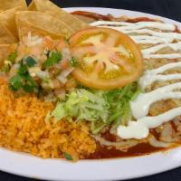 2 Enchiladas W/Rice & Beans · 2 Enchiladas with choice of meat, smothered in mild red salsa and cheese, rice, beans, lettu...