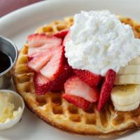 Fruity Waffle · Our famous, buttermilk waffle topped with fresh strawberries, banana, and whipped cream.