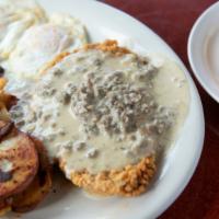 Chicken Fritter Fried Steak And Eggs · Breaded steak, topped with our homemade gravy. Served with 2 eggs any style, and our sliced,...