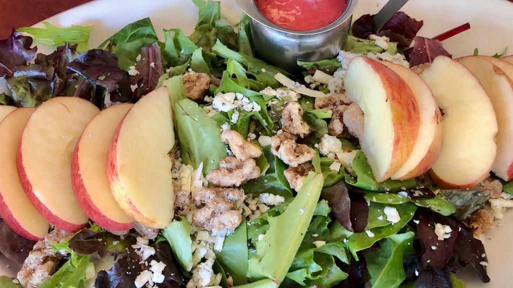 Green Lake Salad · Wild greens drizzled with raspberry vinaigrette dressing, candied walnuts, apple slices and gorgonzola cheese.