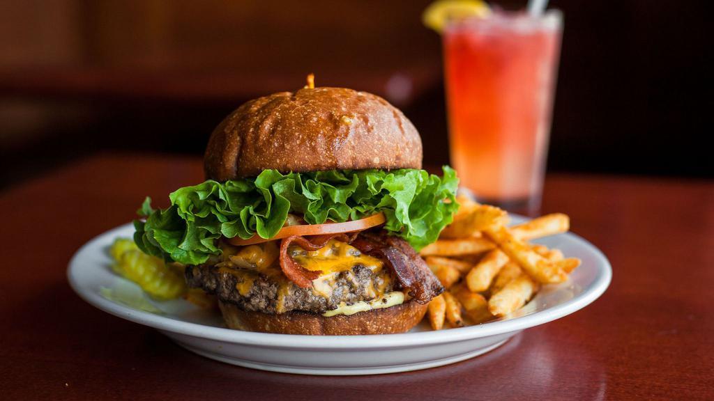 Basic Cheese Burger · Topped with cheddar, Monterey jack, pepper jack, American gorgonzola or swiss, lettuce, tomato, and burger spread. Served with a side of your choice.