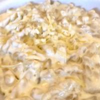 Mac And Cheese · Cavatappi pasta tossed in a creamy aged white cheddar and Gruyere sauce - made to order